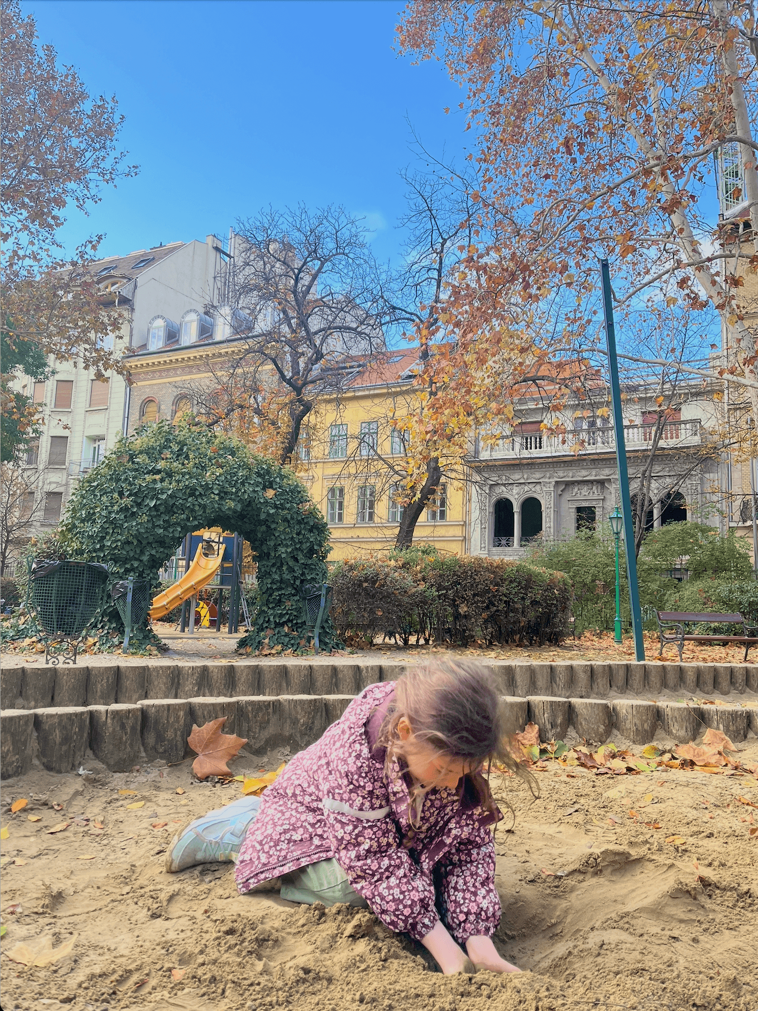 A girl playing in a sandpit in Hungary